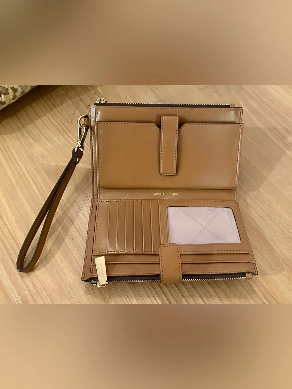 Michael Kors Black Star Print Wristlet with Tan Strap